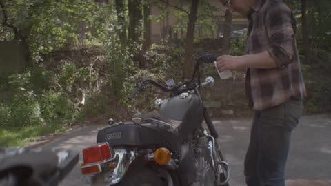 A Man Is Working on His Motorcycle