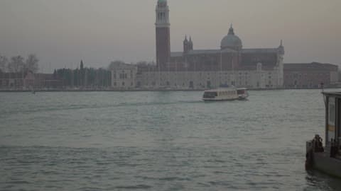A Boat Floats By On The Water