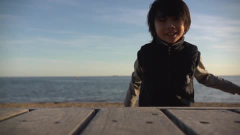 A Kid Playing On The Beach