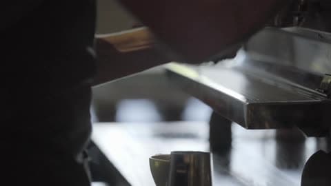 A Man Prepares A Beverage At A Coffee Shop
