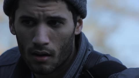 A Man Standing Outside Look For Something