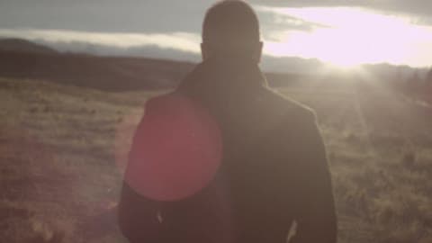 A Man Walking During Sunset