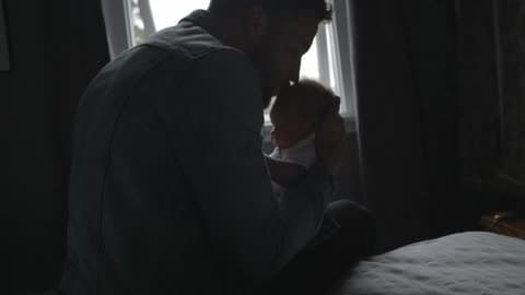 A Person Holding A Baby