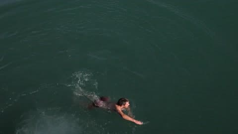 A Person Swimming In The Water