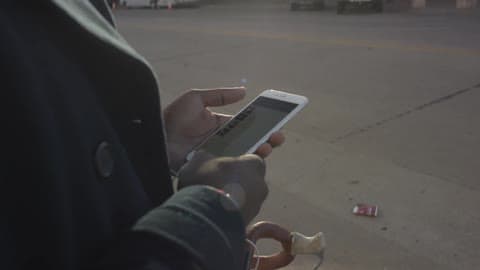 A Person Uses A Smartphone