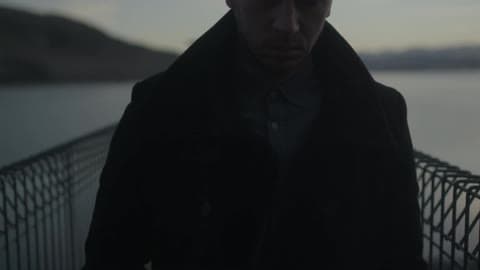 A Person Walking Down A Pier