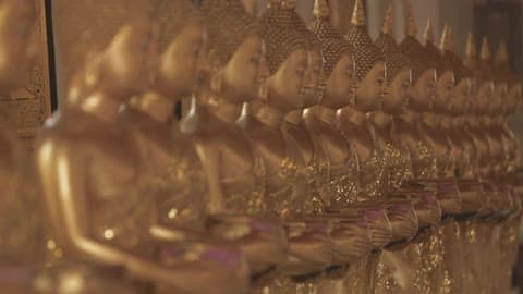 A Row Of Golden Buddha Statues