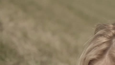 A Woman Crawling Thru The Grass