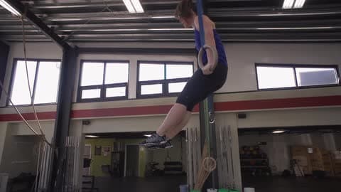 A Woman Doing Ring Pull Ups