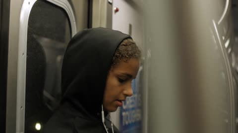 A Woman Sings To Herself While Riding Public Transportation