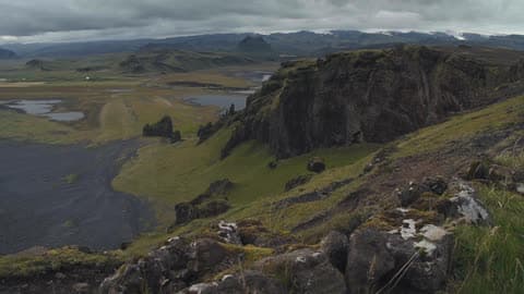 Clouds Hover Over A Valley