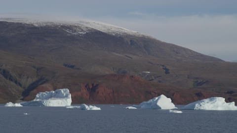 Glaciers Sit In A Lake In The Mountains