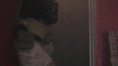 Three Military Men Breaching A Door And Entering