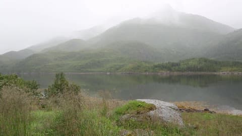 View Of A Mountain And Lake On A Cloudy Day