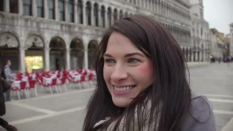 Woman Smiling As Her Photo Is Taken On A Cloudy Day